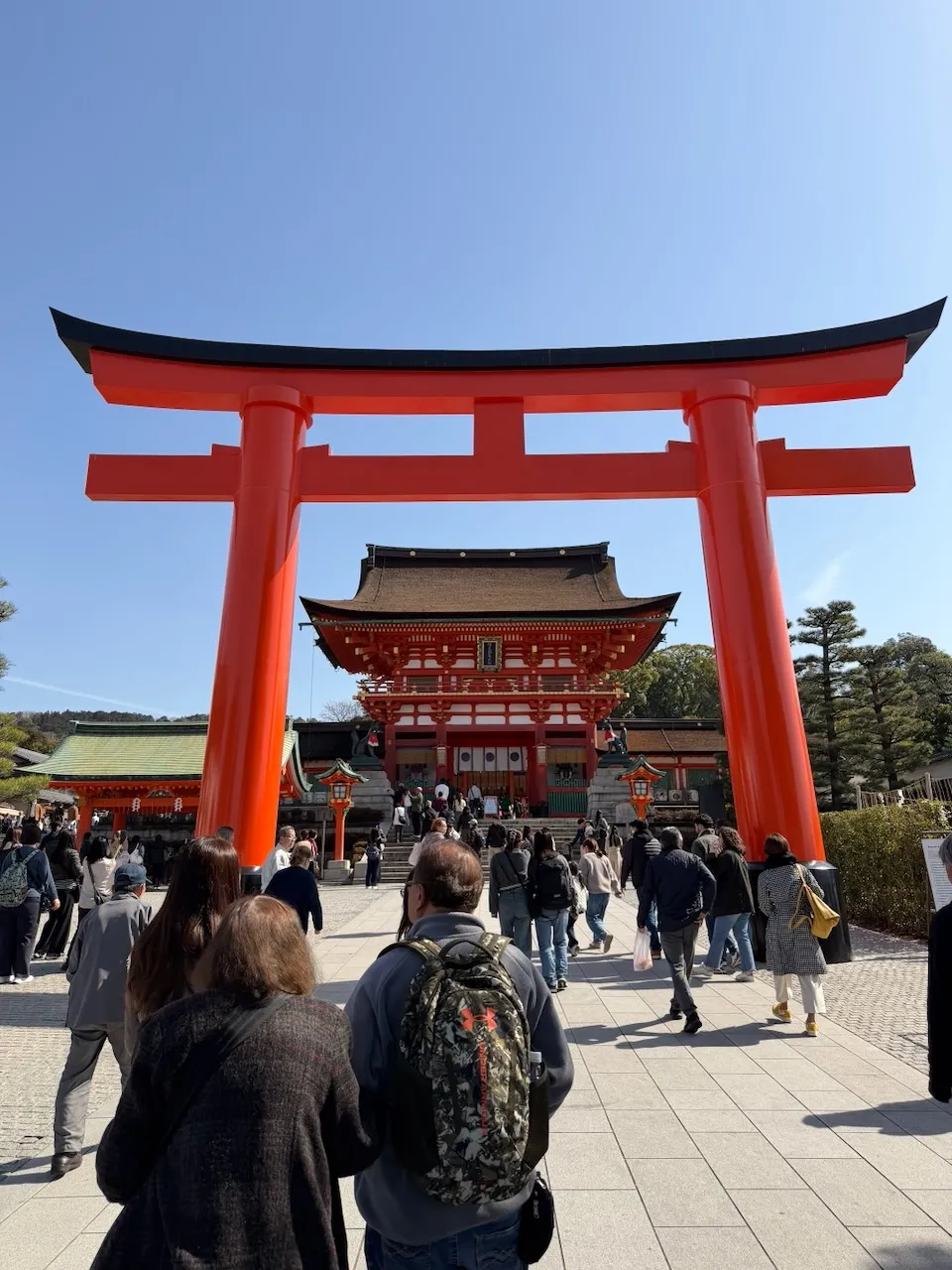 The great torii and the orange Romon gate at the entrance of Fushimi Inari