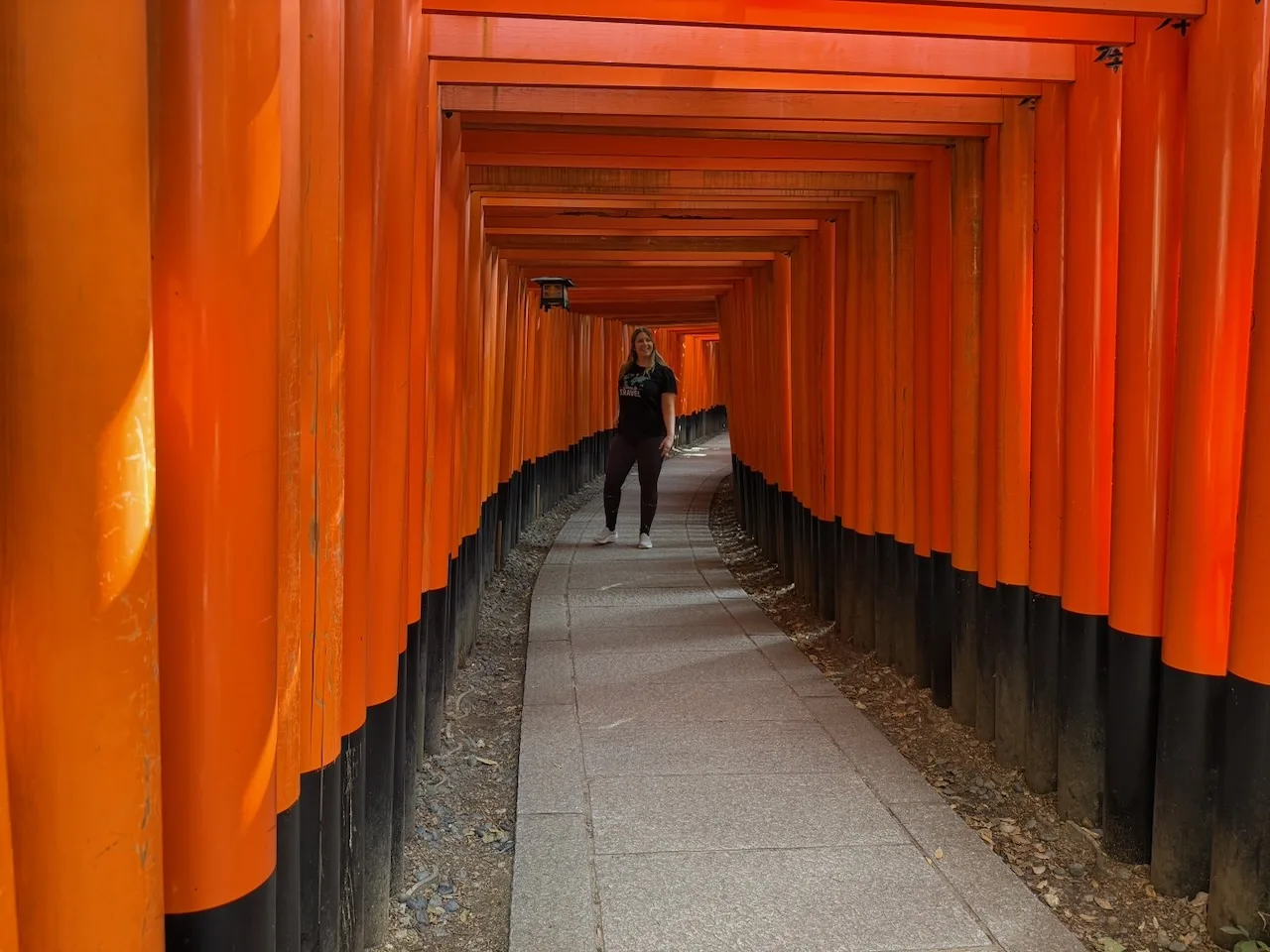 Long path through orange torii gates at Fushimi Inari, Kyoto