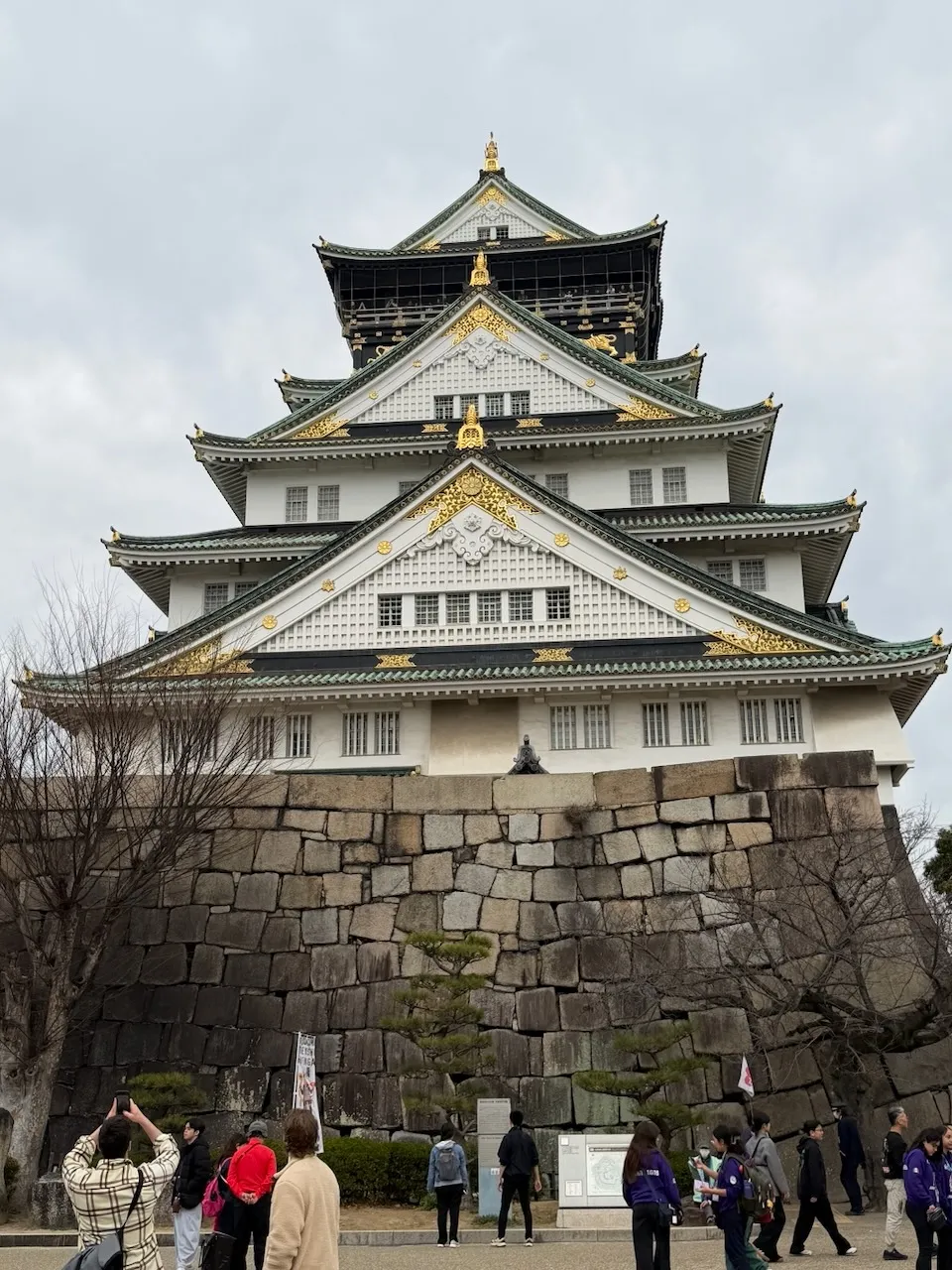 Osaka Castle main keep under a grey sky, February 2026