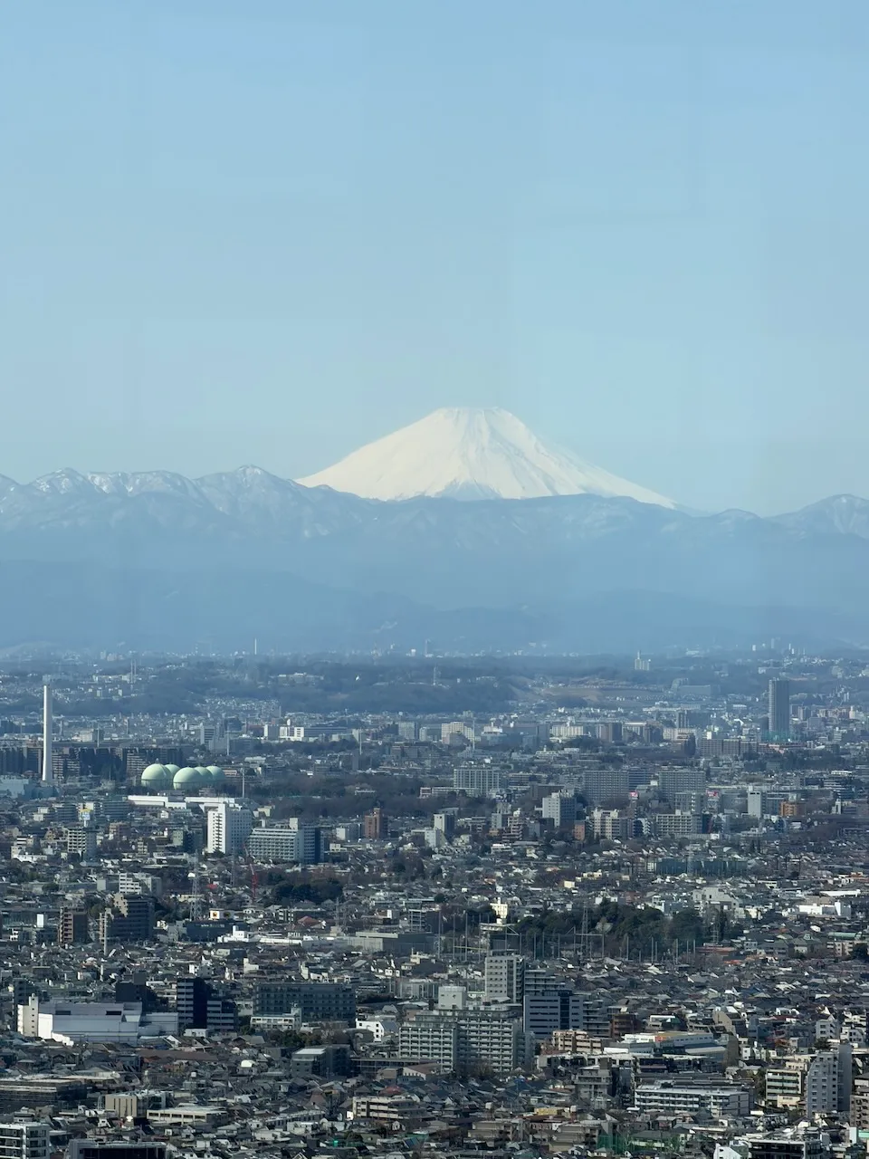 Mount Fuji beyond Tokyo skyline, our photo
